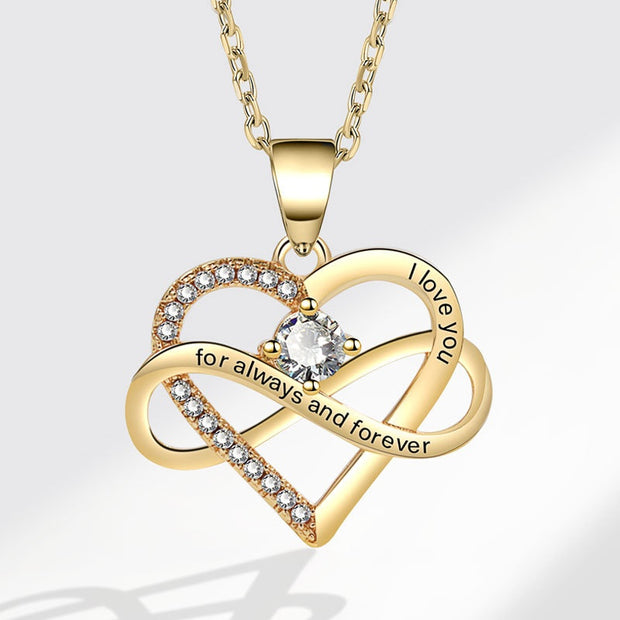 Gold heart-shaped necklace with 'I love you for always and forever' engraving on a white background