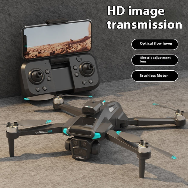 Drone with remote control and smartphone displaying desert landscape on a gray surface.