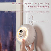 Small night light being attached to a wall with text highlighting its features.