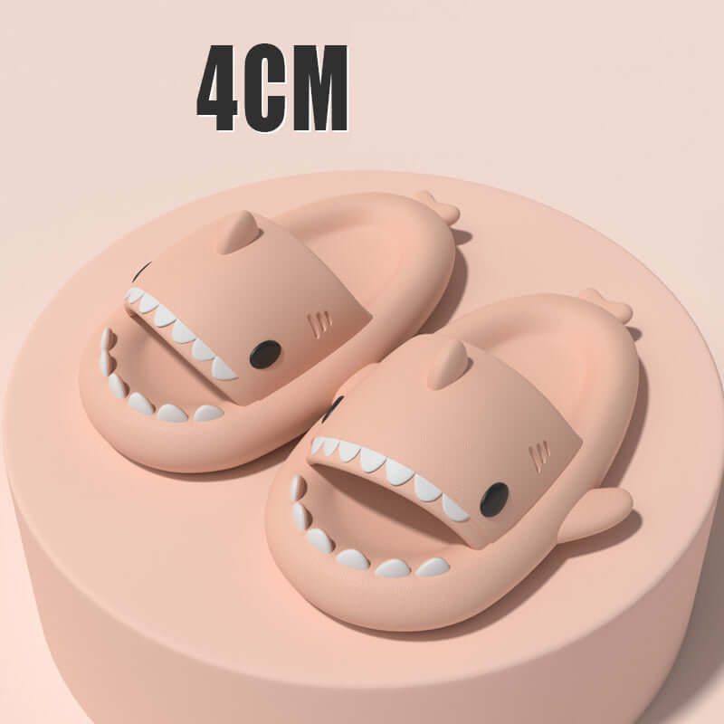 Sharky slippers displayed on a pedestal, featuring cartoon shark design with an ergonomic fit for comfort.
