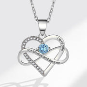 Silver heart-shaped necklace with blue gemstone and 'I love you' engraving on a light gray background