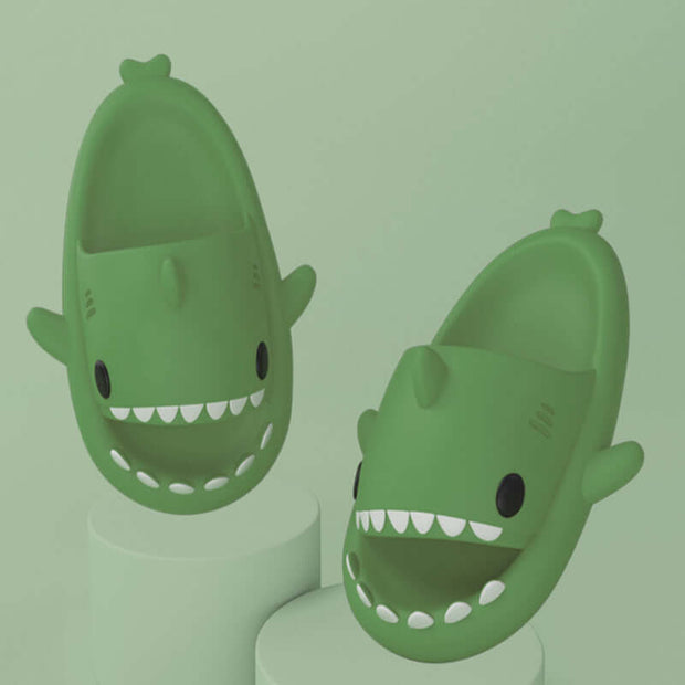Fun green cartoon shark slippers for adults, featuring a cute design and comfortable fit for indoor and outdoor use.