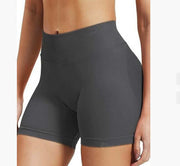 Dark gray athletic shorts worn by a person on a white background