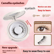 Camellia eyelashes with packaging and usage instructions on a pink background