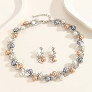 Pearl necklace and earrings set on a light background