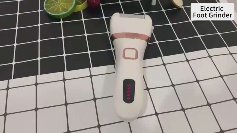 RevivePro Electric Foot Grinder on a tiled surface, showcasing its sleek design and control buttons for easy callus removal.