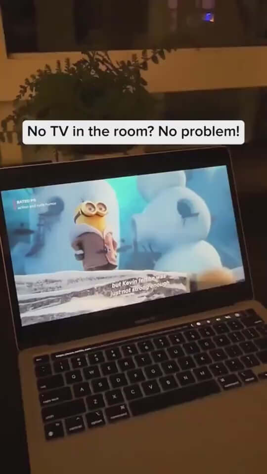 Screenshot of a laptop streaming a cartoon, showcasing a portable projector solution.